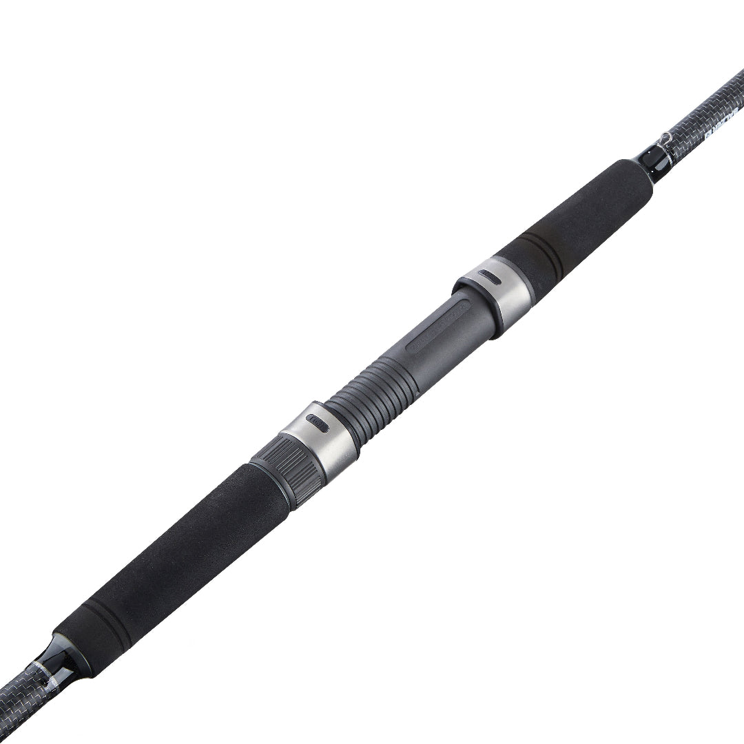 A close-up diagonal view of a black and dark gray fishing rod blank with metallic silver rings and braided line, isolated on a white background.