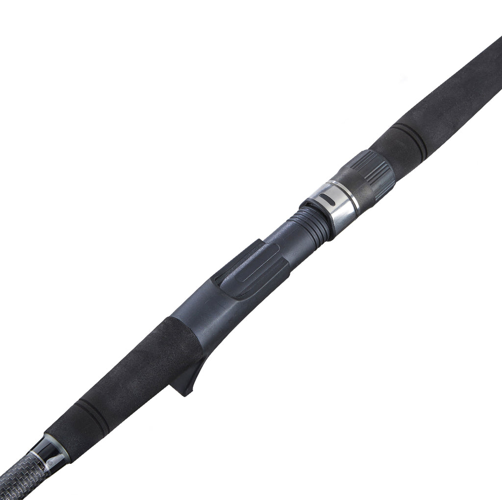 Close-up of a black and dark gray fishing rod blank with textured foam grip and a metallic silver joint, shown diagonally on a white background.
