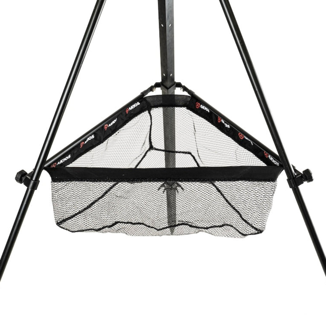 Black sports training net with a stand on a white background