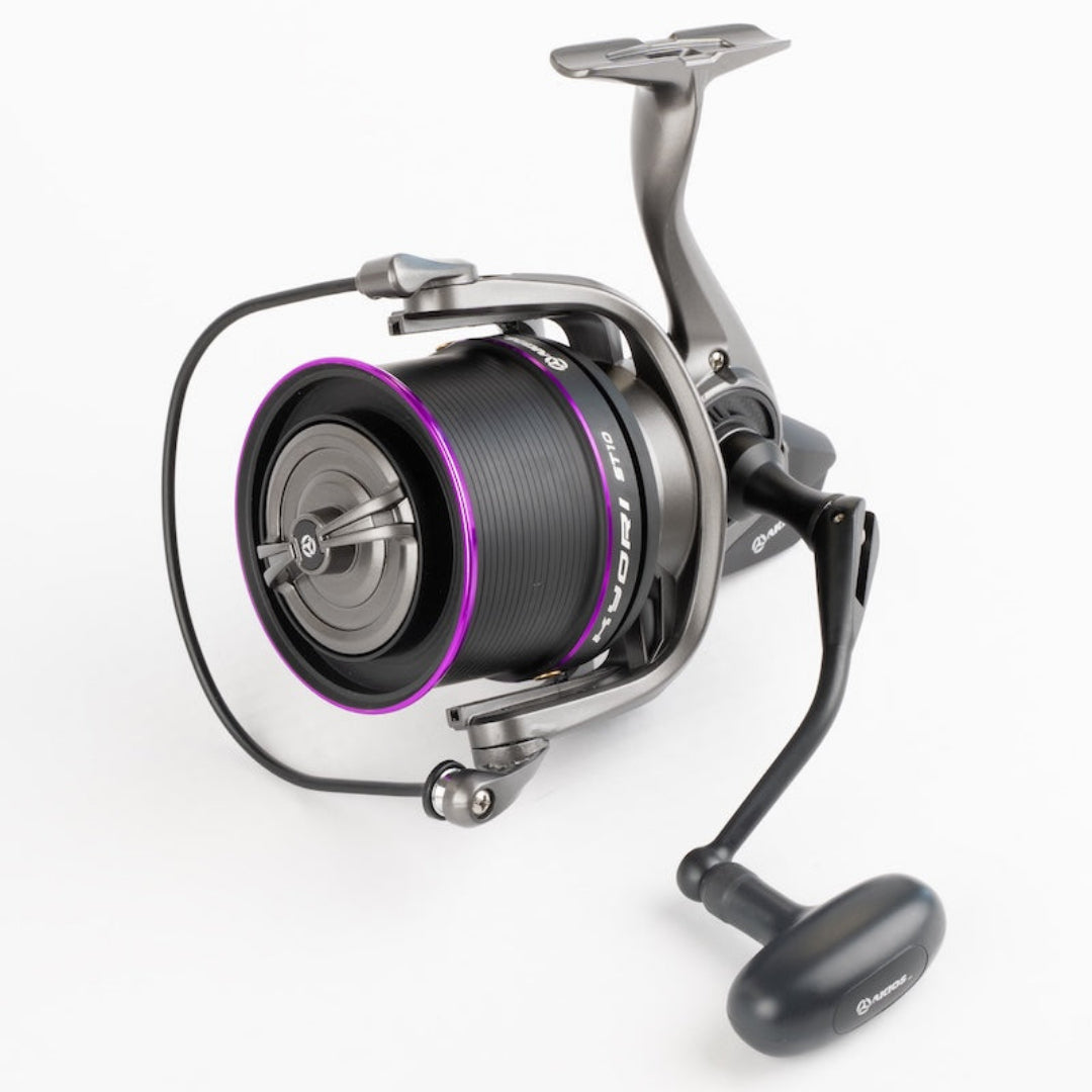 Fishing reel with purple accents on a white background