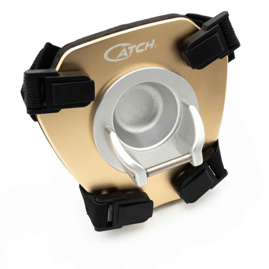 Gold and black thigh mounted fishing gimbal 'Catch' branding on a white background