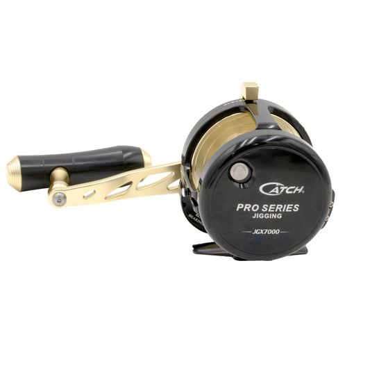 Fishing reel with gold and black accents on a white background