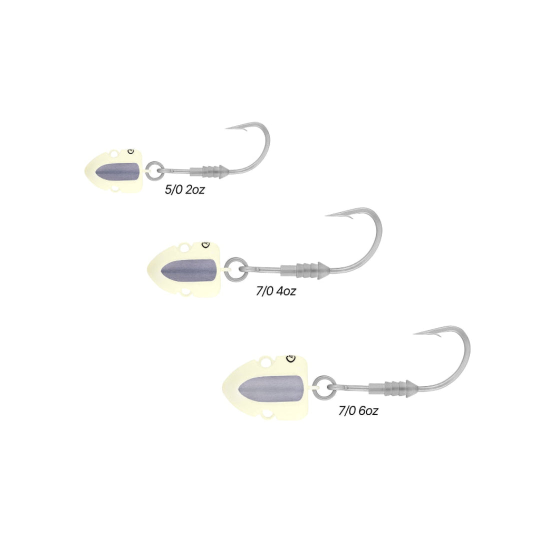 Three fishing jigs with varying weights on a white background