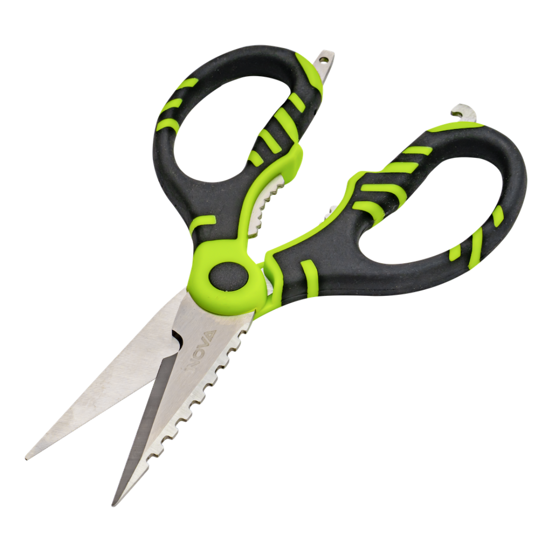 Serrated utility scissors with black and lime green ergonomic handles and stainless steel blades, shown on a plain white background.
