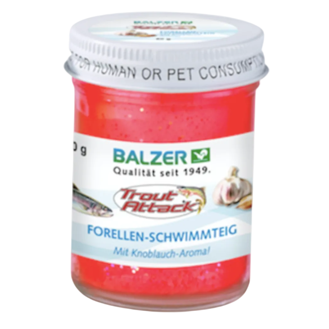A jar of Balzer Trout Attack fishing bait swim piece in red-orange color with a white lid, on a white background.