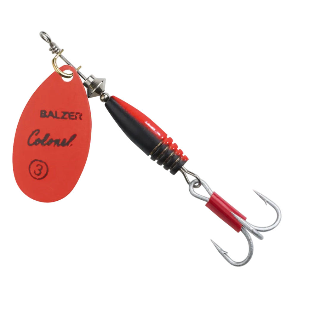 A Balzer Colonel 3 fishing lure with a red and black body, dual silver hooks, and a red oval tag attached, shown on a plain white background.