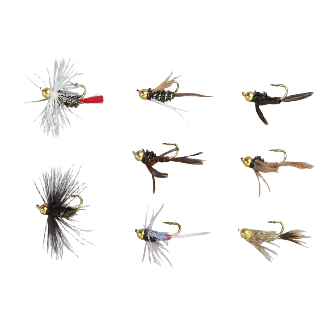 Collection of various fly fishing lures on a gray background