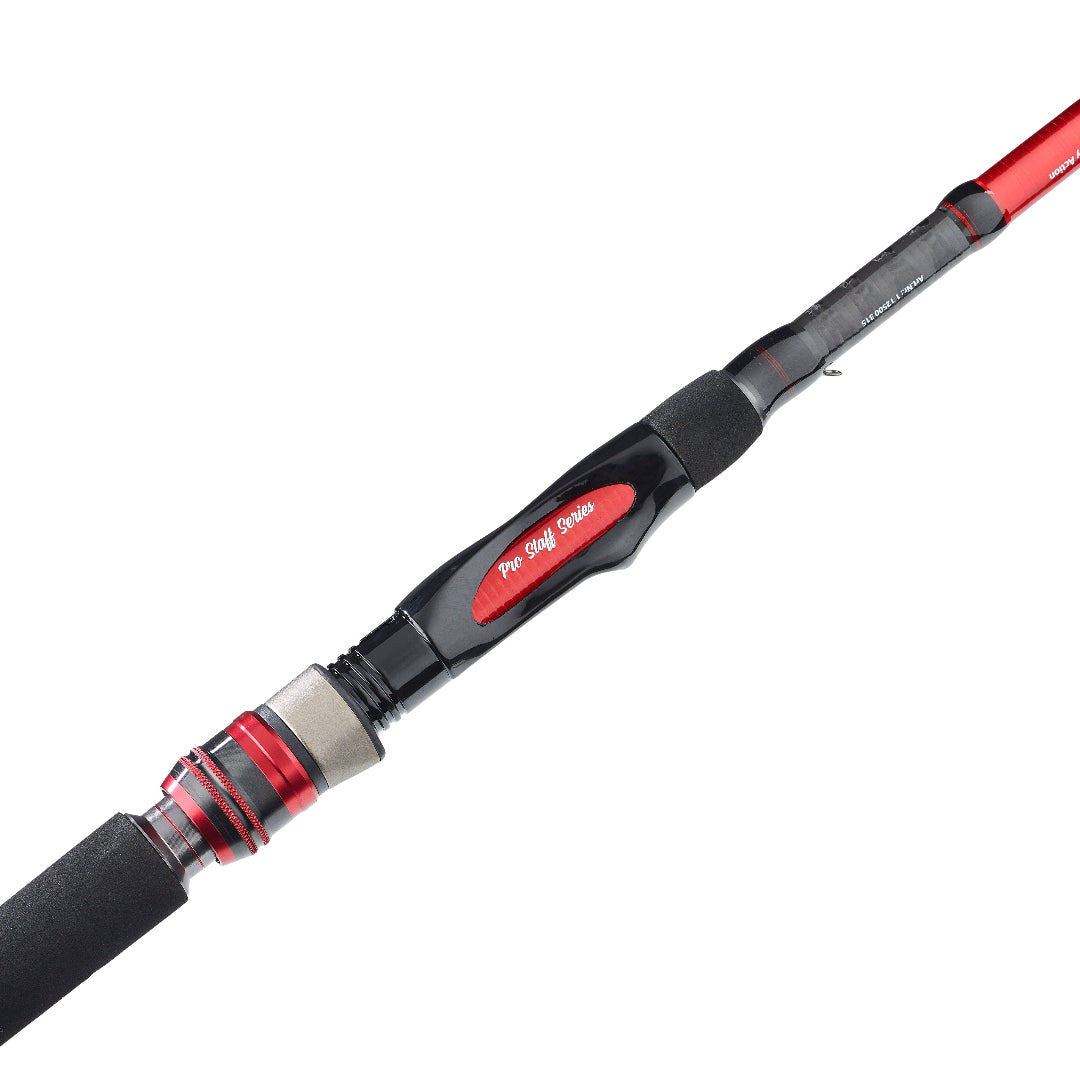 A close-up of a fishing rod featuring a black handle with a red accent labeled 'Pro Line Series' and red metallic accents on the reel seat and rod blank, set against a solid white background.