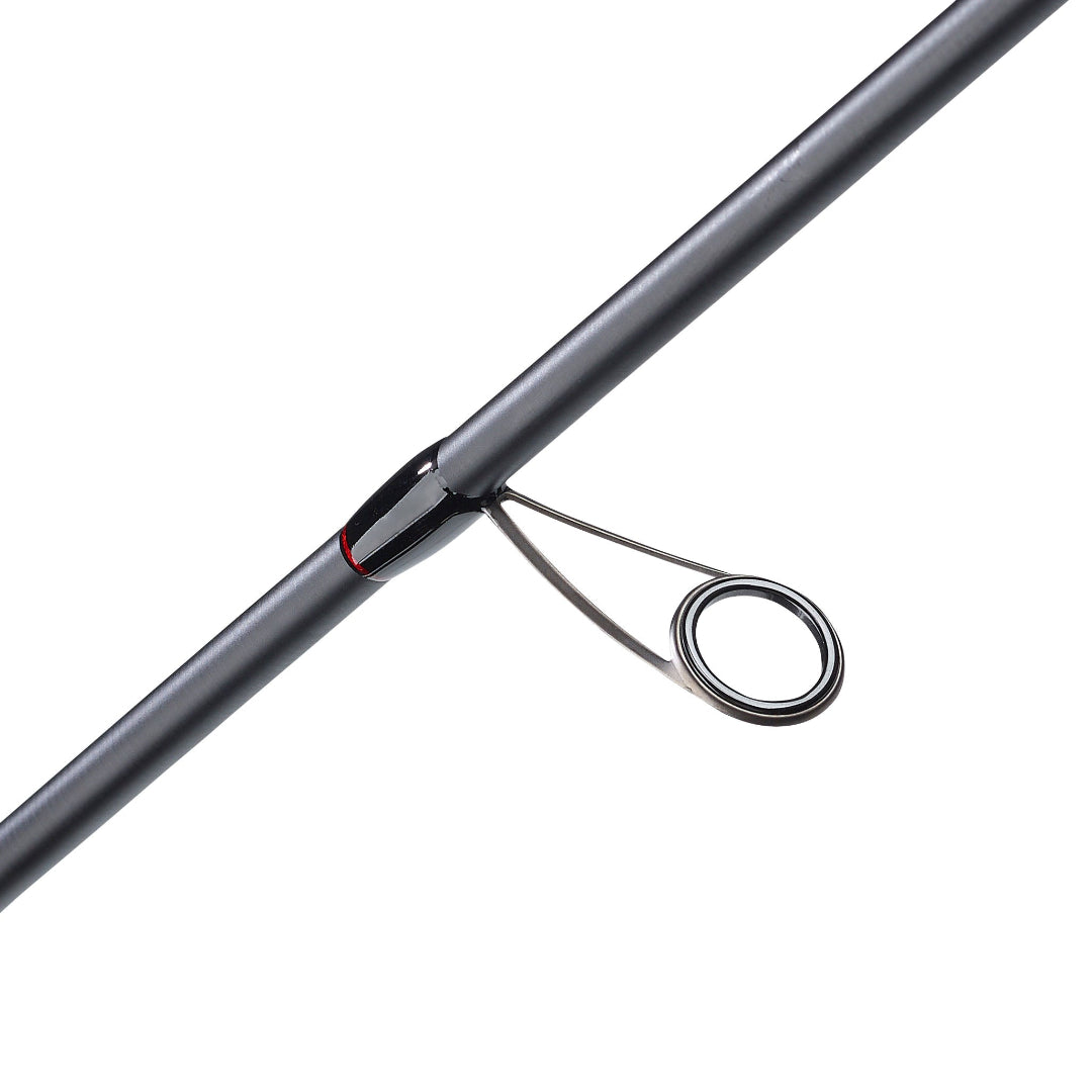 Close-up of a dark gray fishing rod section with a black line guide and loop on a plain white background.
