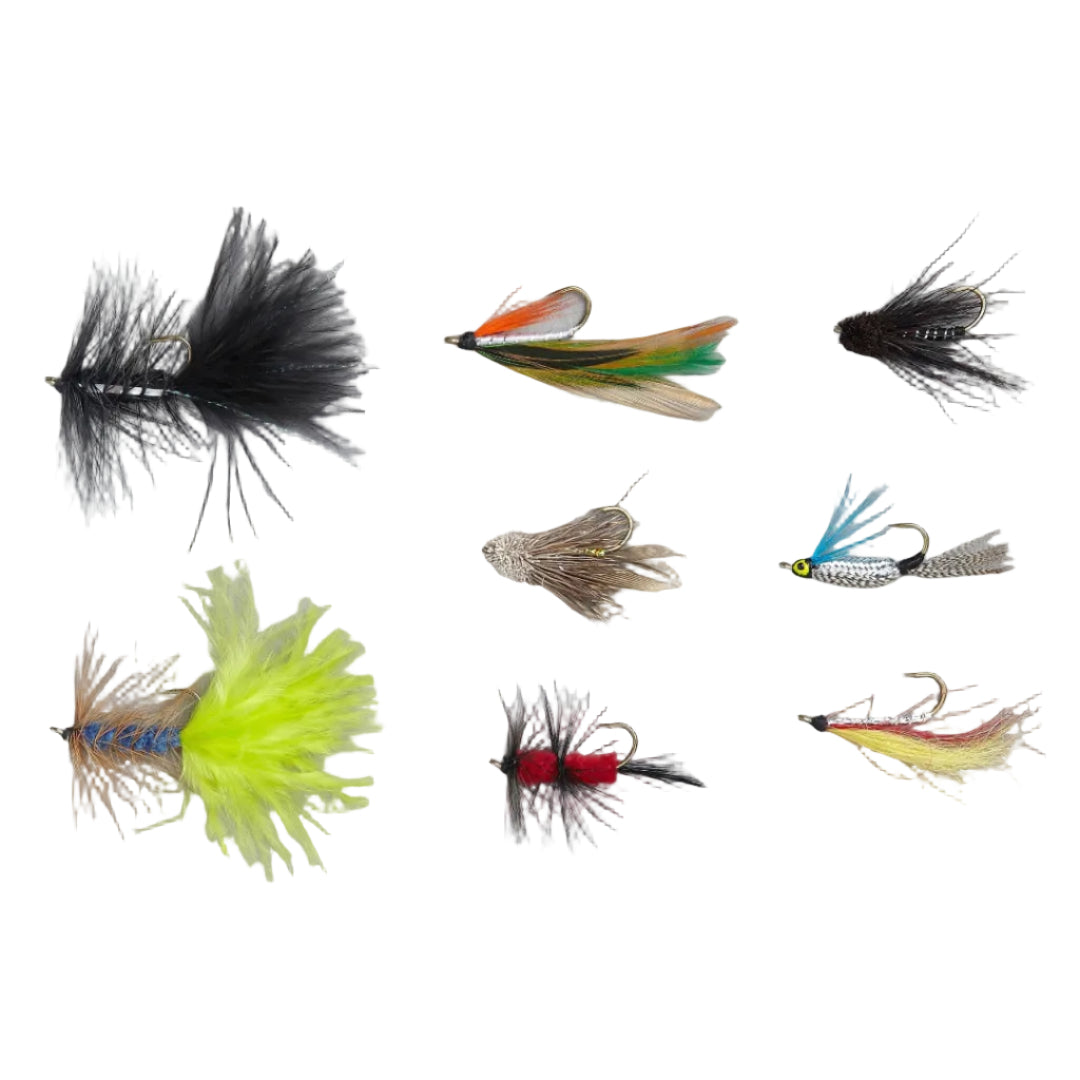 Collection of various fly fishing lures on a gray background
